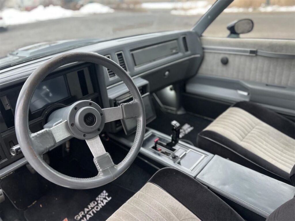 The interior, on the other hand, remains mostly untouched, with the original seats and interior components preserved in their pristine condition. - Image 12